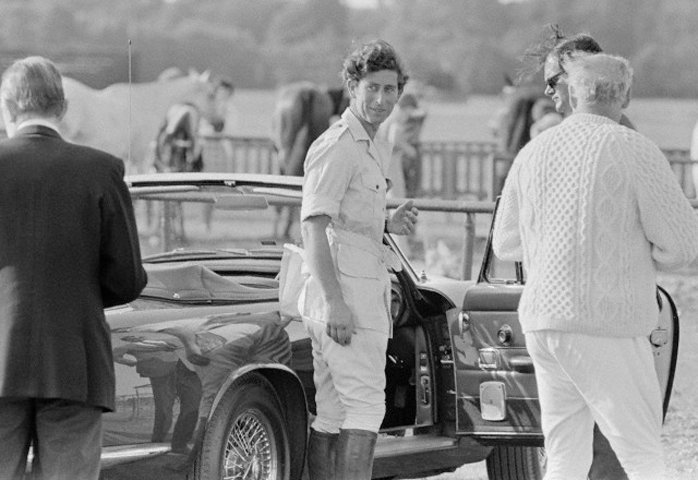 01 Jun 1975, Ascot, Berkshire, England, UK --- Charles, Prince of Wales, stands next to a car at the Royal Ascot horse races.